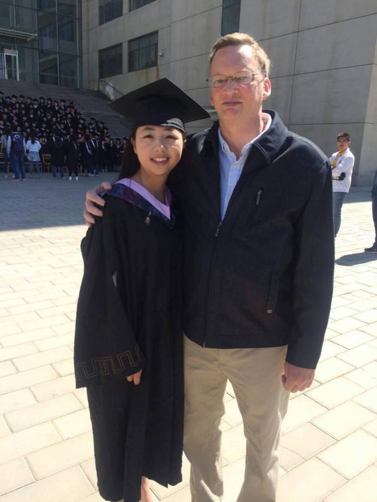 Jim McCoy with a student at Baotou Teachers College